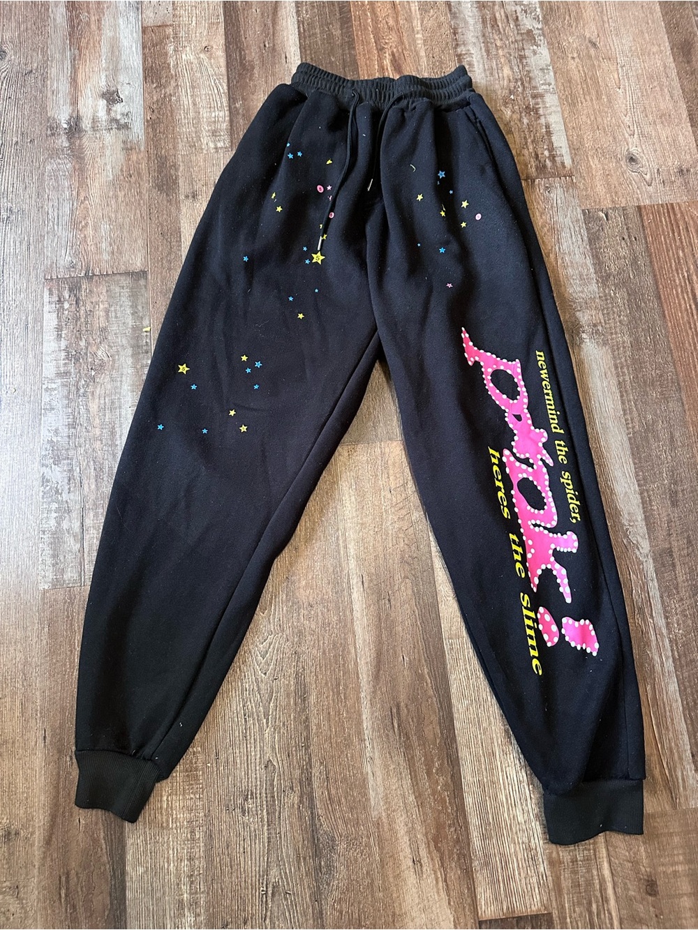 Women’s Spider Worldwide Black Graphic Jogger Sweatpants with Pink Script